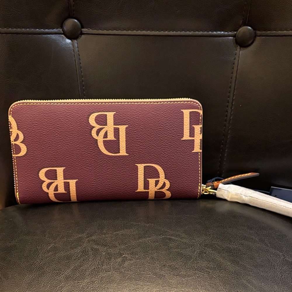 Dooney & Bourke Wine monogram zip around wristlet Wallet